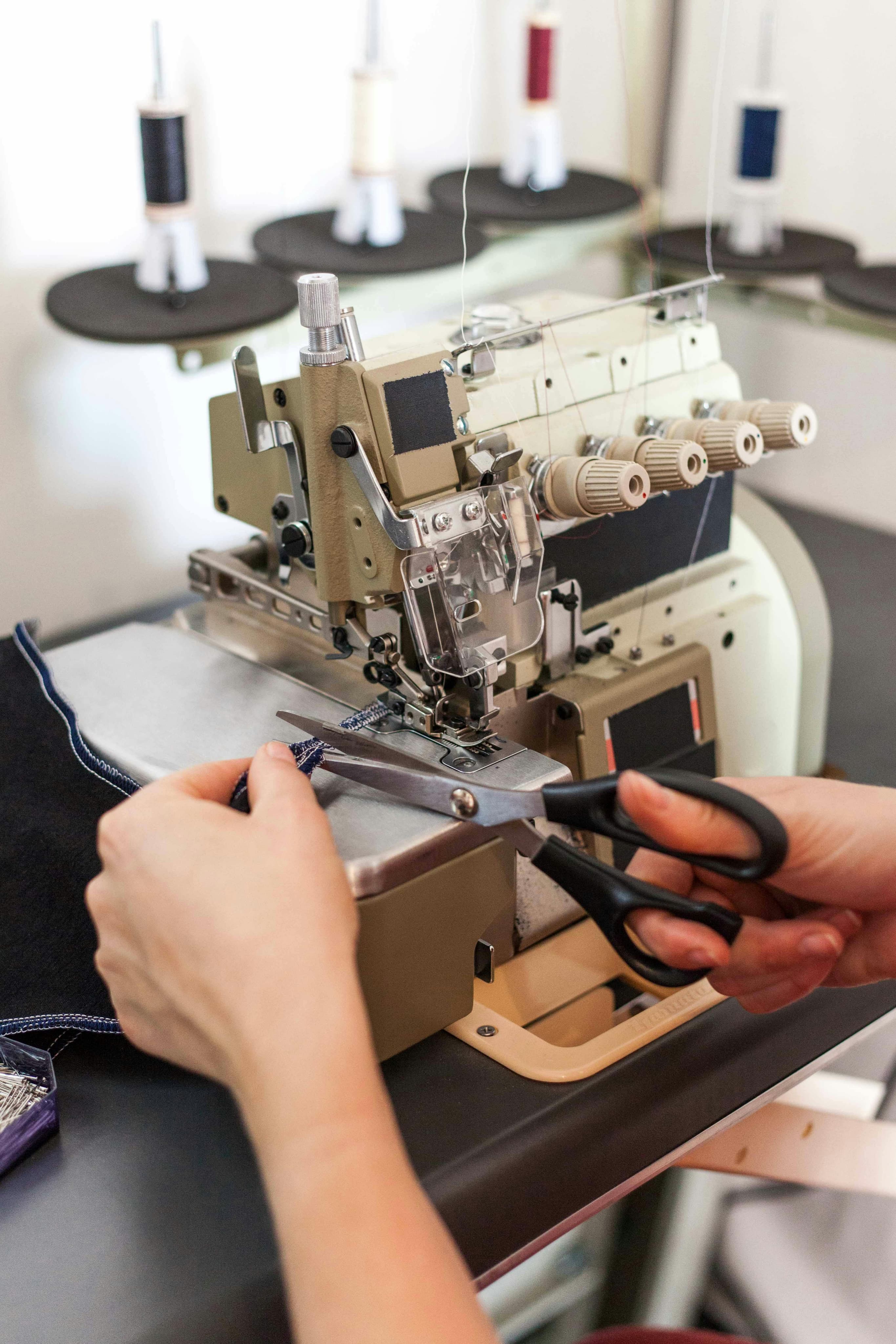 Tailoring machine finishing a garment
